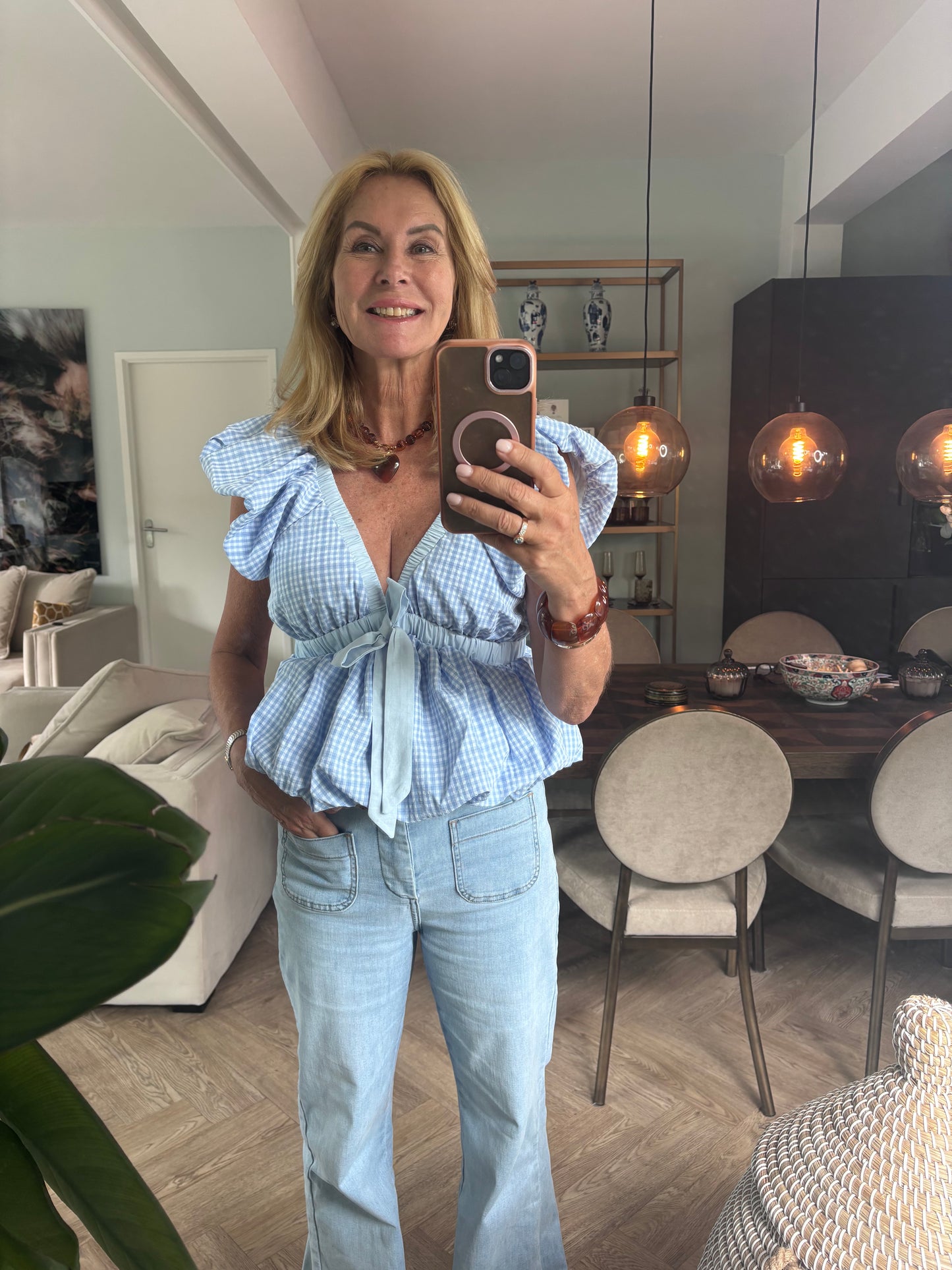Licht blauwe ruit blouse