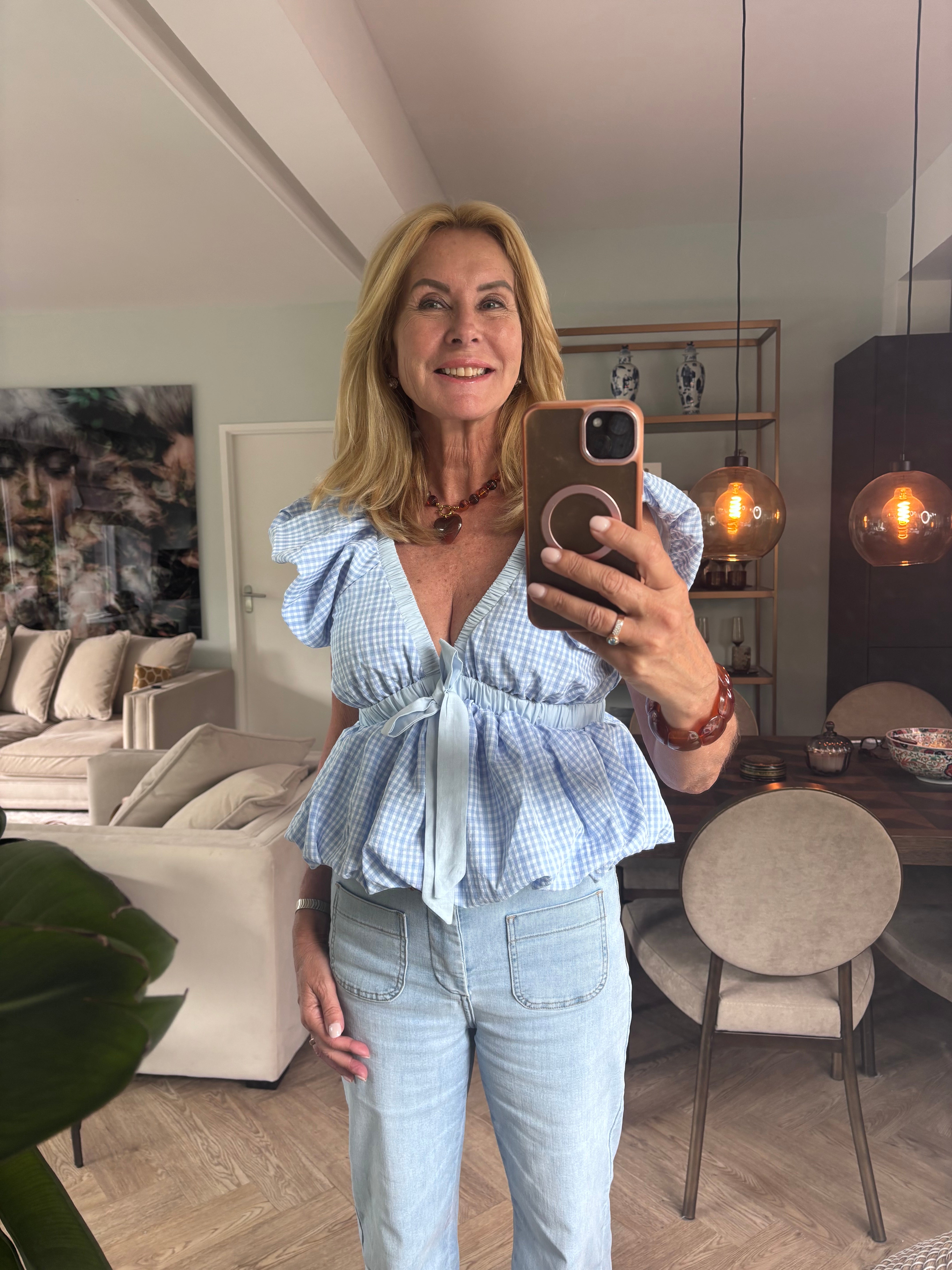 Licht blauwe ruit blouse